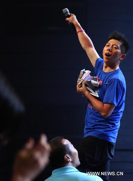 Hu Haiquan of the Chinese pop group 'Yu Quan' performs on stage during their nation tour in Dongguan, south China's Guangdong Province, May 10, 2011. [Chen Fan/Xinhua]