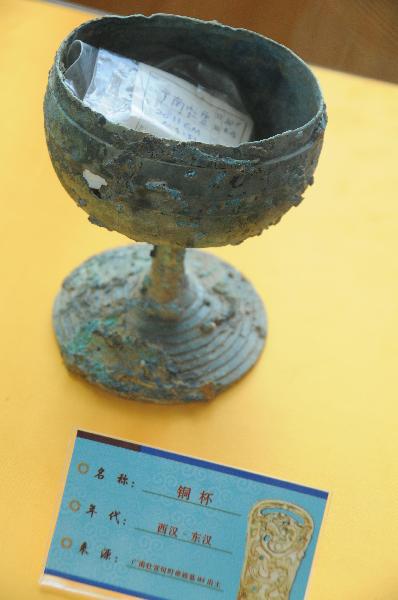 Photo taken on May 9, 2011, shows a bronze cup unearthed in an ancient noble tomb in Guangnan County, southwest China's Yunnan Province.