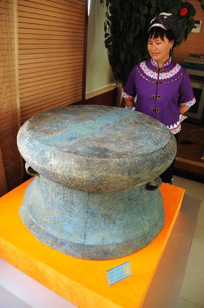 Photo taken on May 9, 2011, shows a bronze drum unearthed in an ancient noble tomb in Guangnan County, southwest China's Yunnan Province. 