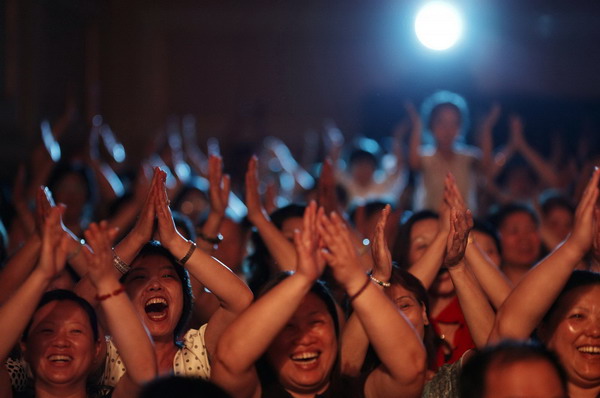 Audience members cheer during an audition for the television show 'China's Got Talent' in downtown Shanghai May 10, 2011.[Photo/Agencies]