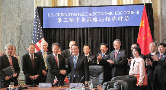 US Treasury Secretary Tim Geithner (4th L) and Chinese Vice-Premier Wang Qishan shake hands after participating in a signing ceremony for a 'US-China Comprehensive Framework for Promoting Strong, Sustainable and Balanced Growth and Economic Cooperation', during the US-China Strategic and Economic Dialogue at the Treasury Department in Washington May 10, 2011. [Xinhua]
