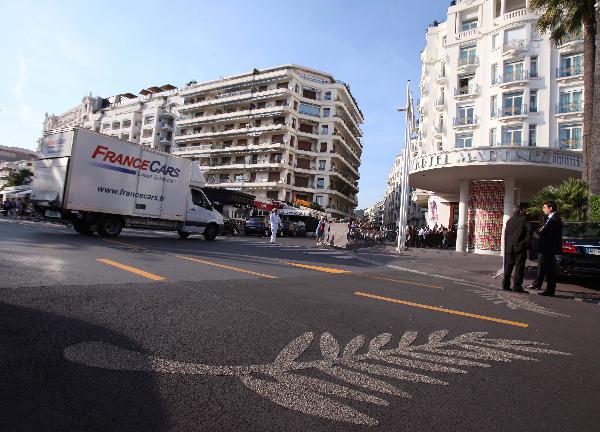 A huge logo of Cannes film festival is seen on a street in Cannes, France, May 10, 2011. The 64th Cannes Film Festival will be held here from May 11 to 22, 2011. 