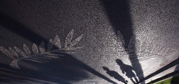 Shadows of a couple are seen on the street with the logo of Cannes film festival beside them in Cannes, France, May 10, 2011. The 64th Cannes Film Festival will be held here from May 11 to 22, 2011. 