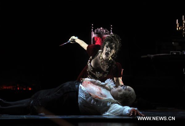 Artists perform during a dress rehearsal of Giacomo Puccini's opera 'Tosca' in Beijing, capital of China, May 10, 2011. The version of 'Tosca', directed by Giancarlo Del Monaco, is due to premiere in National Centre for the Performing Arts in Beijing on Thursday.