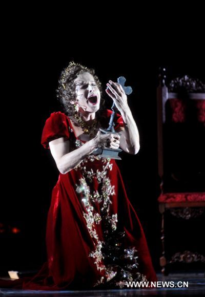 An artist performs during a dress rehearsal of Giacomo Puccini's opera 'Tosca' in Beijing, capital of China, May 10, 2011. The version of 'Tosca', directed by Giancarlo Del Monaco, is due to premiere in National Centre for the Performing Arts in Beijing on Thursday.