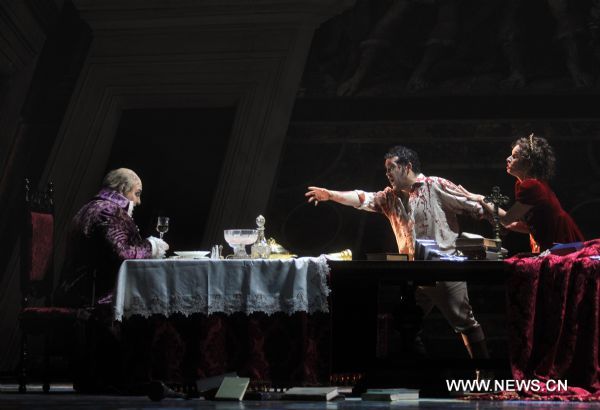 Artists perform during a dress rehearsal of Giacomo Puccini's opera 'Tosca' in Beijing, capital of China, May 10, 2011. The version of 'Tosca', directed by Giancarlo Del Monaco, is due to premiere in National Centre for the Performing Arts in Beijing on Thursday. 