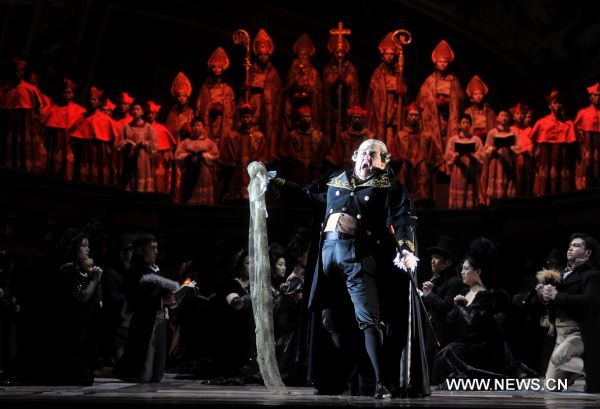 Artists perform during a dress rehearsal of Giacomo Puccini's opera 'Tosca' in Beijing, capital of China, May 10, 2011. The version of 'Tosca', directed by Giancarlo Del Monaco, is due to premiere in National Centre for the Performing Arts in Beijing on Thursday.