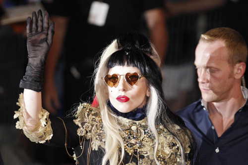 Singer Lady Gaga waves to fans after she performed on the Canal Plus television show 'Le Grand Journal' in Cannes during the 64th Cannes Film Festival, May 11, 2011