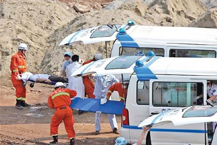 Firefighters and medical staff from Guangyuan, Sichuan province, run through emergency procedures in this 2010 photo.