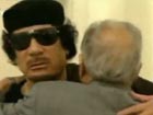 Libyan TV shows pictures of Gaddafi holding meeting
