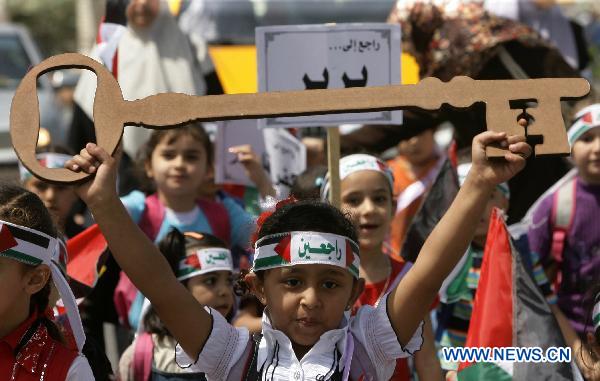 A Palestinian girl holds a key symbolizing returning home during a rally in Gaza City, May 12, 2011. The rally is to mark the 63rd anniversary of al-Nakba Day when Israeli forces had ousted thousands of Palestinian families from their homes and established the Jewish state on May 15, 1948. [Xinhua/Yasser Qudih]