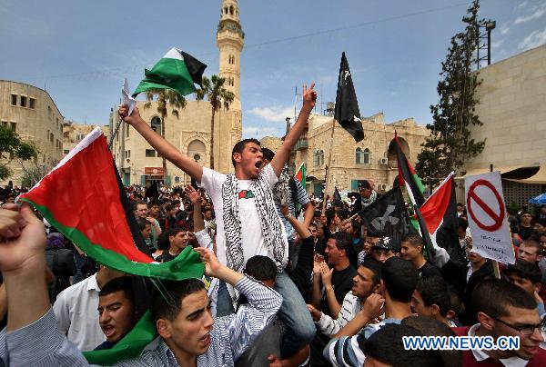 Palestinians attend a rally in front of the church of Nativity in the West Bank city of Bethlehem, May 12, 2011, to mark the 63rd anniversary of al-Nakba Day when Israeli forces had ousted thousands of Palestinian families from their homes and established the Jewish state on May 15, 1948. [Xinhua/Luay Sababa]