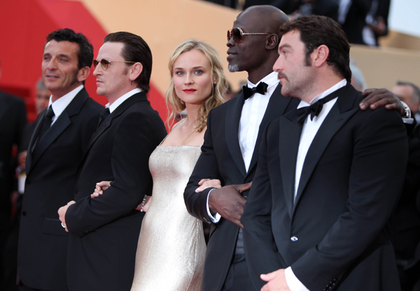 German actress Diane Kruger (C) poses on the red carpet before the screening of 'Sleeping Beauty' presented in competition at the 64th Cannes Film Festival in Cannes, France, May 12, 2011. 