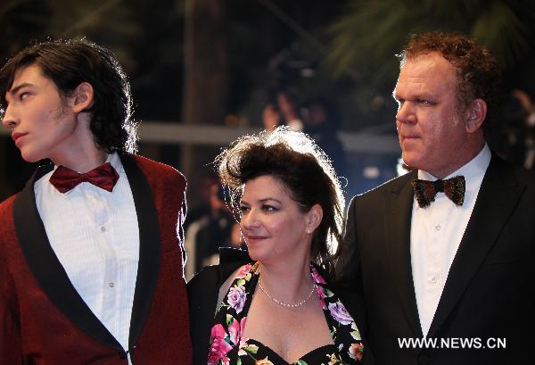 British actor Ezra Miller(L), British director Lynne Ramsay (C) and John C. Reilly pose on the red carpet before the screening of 'We Need to Talk About Kevin' presented in competition at the 64th Cannes Film Festival on May 12, 2011 in Cannes.