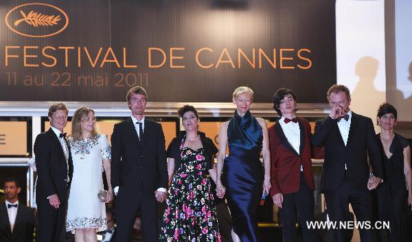 Cast members of 'We Need to Talk About Kevin' pose on the red carpet before the screening at the 64th Cannes Film Festival in Cannes, on May 12, 2011. 