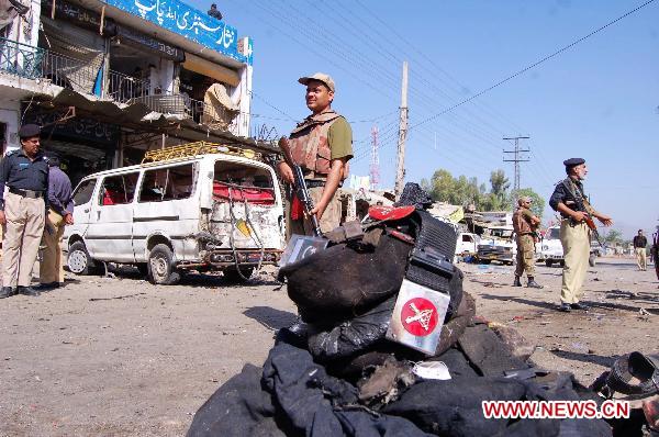 Pakistani soldiers cordon off the blast site in northwest Pakistan&apos;s Charsadda on May 13, 2011. [Xinhua/Saeed Ahmad] 