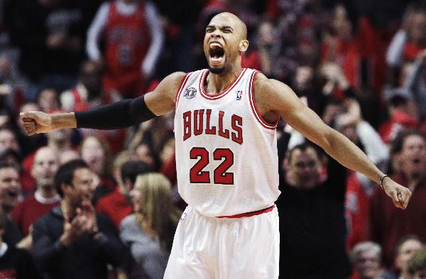 Chicago Bulls' Taj Gibson celebrates after a dunk on the Miami Heat during the first half in Game 1 of their NBA Eastern Conference Finals playoff basketball game in Chicago May 15, 2011. (Xinhua/Reuters Photo) 