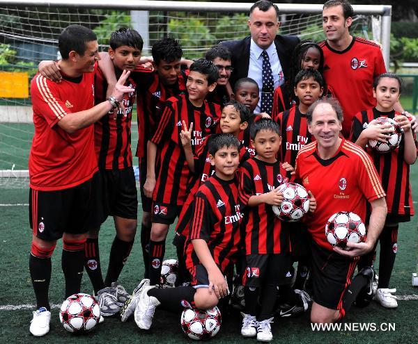 Italian football legend Franco Baresi (R front) poses for photo after the media conference in Hong Kong, south China, May 16, 2011 to announce the launch of AC Milan Soccer Schools in Hong Kong. (Xinhua/Lo Ping Fai)