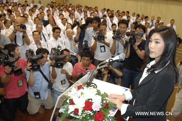 Yingluck Shinawatra (front), the youngest sister of deposed former Prime Minister Thaksin Shinawatra, speaks at a Phue Thai party meeting in Bangkok, capital of Thailand, on May 16, 2011. 