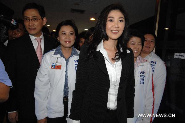 Yingluck Shinawatra (front), the youngest sister of deposed former Prime Minister Thaksin Shinawatra, attends a Phue Thai party meeting in Bangkok, capital of Thailand, on May 16, 2011. 