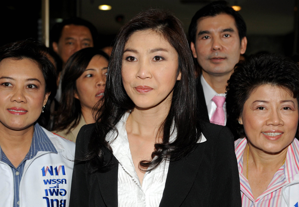 Yingluck Shinawatra (C), the youngest sister of deposed former Prime Minister Thaksin Shinawatra, attends a Phue Thai party meeting in Bangkok, capital of Thailand, on May 16, 2011. Yingluck Shinawatra was voted to be No. 1 on Phue Thai party list, which means she will compete for the first female prime minister of the country.