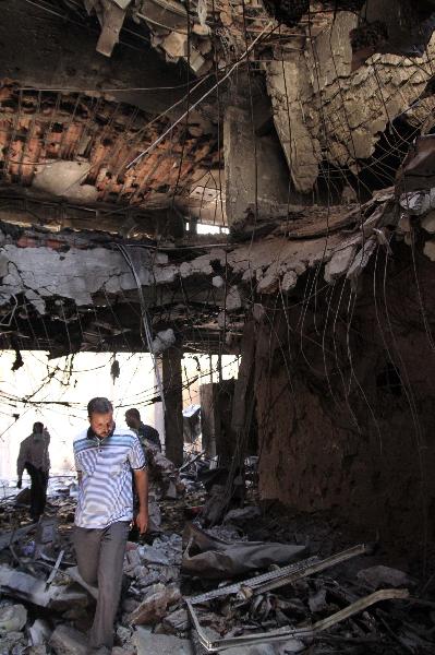 Photo taken on May 17, 2011 shows a destroyed building after NATO's aerial bombardment in Tripoli, Libya. [Hamza Turkia/Xinhua]