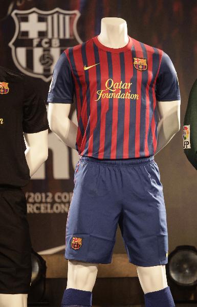 The new Barcelona jersey for the 2011-2012 season with the Qatar Foundation logo is displayed during its presentation at Camp Nou stadium in Barcelona May 17, 2011. (Xinhua/Reuters Photo) 