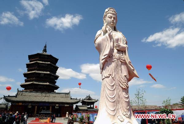 The undated file photo shows the Sakyamuni Pagoda in Yingxian County, north China's Shanxi Province. Authorities in north China's Shanxi Province said Sunday that they would finish the application for the Sakyamuni Pagoda, the oldest wooden structures in the world, by July for it to be included on the UNESCO list of cultural relics by 2013. 