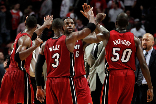 Dwyane Wade, LeBron James and Joel Anthony of Miami Heat celebrate after they won 85-75 against the Chicago Bulls in Game 2 of the Eastern Conference Finals during the 2011 NBA Playoffs on May 18, 2011 at the United Center in Chicago, Illinois.