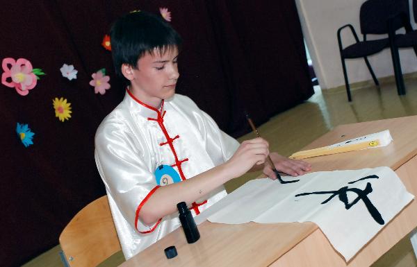 A contestant performs during the Chinese language proficiency competition in Kiev, capital of Ukraine, May 19, 2011. The Ukrainian round of the Fourth 'Chinese Bridge' -- Chinese Proficiency Competition for High School Students took place here on Thursday with the participation of 13 contestants. 