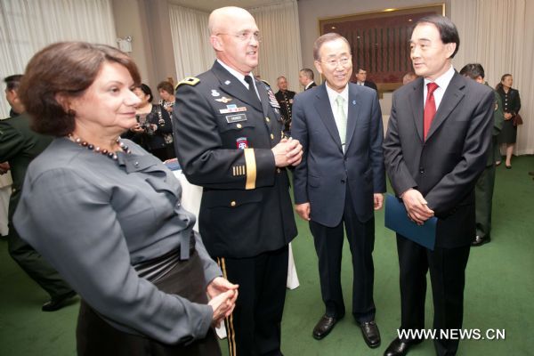 Li Baodong, Chinese permanent representative to the United Nations, United Nations Secretary-General Ban Ki-moon, Major General Karl Horst and Rosemary A. DiCarlo, U.S. Deputy Permanent Representative to the United Nations (from R to L), talk during a reception prior to a joint concert by the Military Band of the People's Liberation Army of China and the Untied States Army Band 'Pershing's Own' at the United Nations headquarters in New York, the United States, May 20, 2011. 