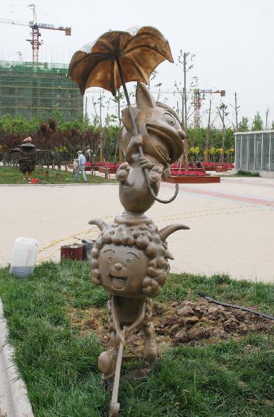 Photo taken on May 22, 2011 shows the cartoon images of Chinese famous characters, before the gate of the National Animation Industry Park, in Tianjin, north China. National Animation and Industry Comprehensive 