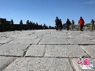 The Lugou Bridge, also known as the Marco Polo Bridge, is a famous stone bridge located 15 km southwest of the Beijing city center across the Yongding River. Situated at the eastern end of the bridge is the Wanping Fortress, a historic 17th century fortress. The Lugou Bridge is well-known because it was highly praised by the Venetian traveler Marco Polo during his visit to China in the 13th century, and for the Marco Polo Bridge incident, which marked the beginning of the Sino-Japanese War (1937-1945).