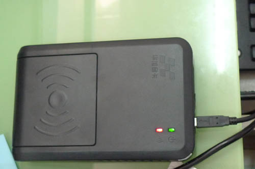 An ID card reader seen at an authorized ticket office coded 'West A018' located in eastern Beijing on Sunday, May 22, 2011. An office staff explains the reader would be used to examine ID cards, a prerequisite for anyone buying a train ticket. Without an ID card, the station can't sell a ticket.