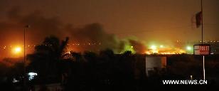 Fire and smokes erupt from a Pakistan' military air base after an attack by militants in southern Pakistan's Karachi on May 23, 2011. Four foreigners reportedly killed in a terrorist attack at a Pakistan Air Force base in Karachi late Sunday night, local Urdu TV channel ARY reported. [Masroor/Xinhua]