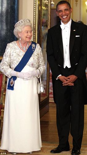 Both Michelle Obama and the Queen opted for long white gowns on the special occassion, but luckily weren't wearing the same dress. [People's Daily]