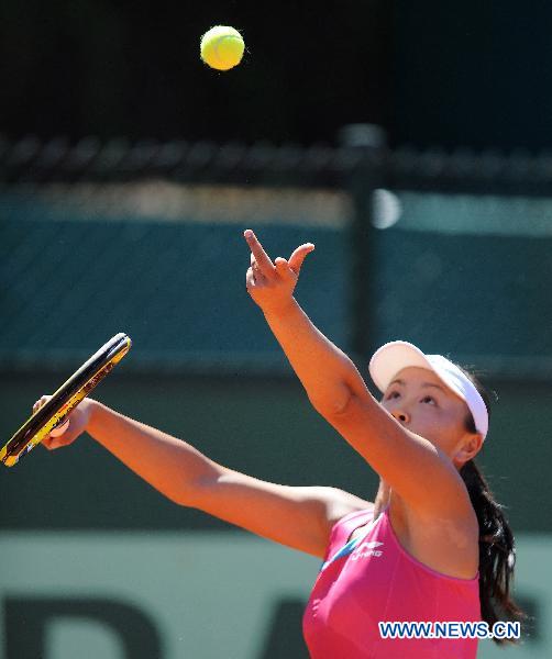 Peng Shuai of China serves during the second round match of women's singles against Polona Hercog of Slovenia in the French Open tennis tournament at the Roland Garros in Paris May 25, 2011. Peng won 2-0. (Xinhua/Xu Liang) 