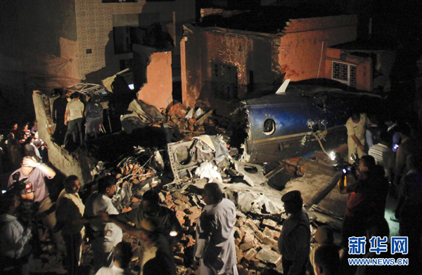 A small chartered civil aircraft with seven people including two pilots on board crashed into a residential area near Delhi on Wednesday night, and 9 people were killed, according to local sources.