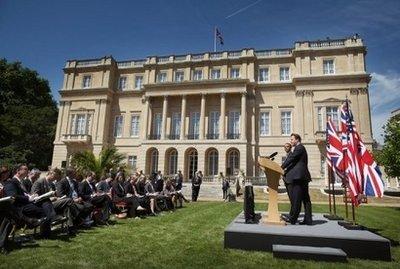 US President Barack Obama listens to Britain's Prime Minister David Cameron at a joint press conference at the Lancaster House in London.