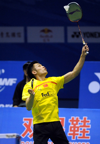 Lin Dan of China returns a ball during the match against P. Kashyap of India in the quarter-finals of the Sudirman Cup.