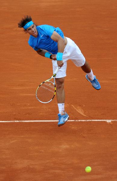 Rafael Nadal of Spain serves the ball during the second round match of men's singles against his compatriot Pablo Andujar in the French Open tennis tournament at the Roland Garros in Paris May 26, 2011. Nadal won 3-0. (Xinhua/Xu Liang) 