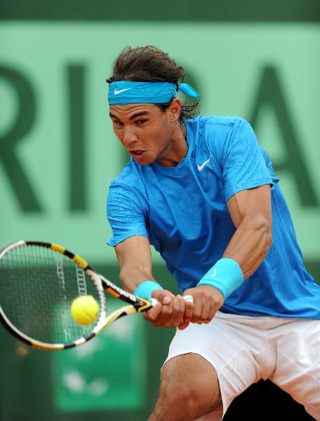 Rafael Nadal of Spain returns the ball during the second round match of men's singles against his compatriot Pablo Andujar in the French Open tennis tournament at the Roland Garros in Paris May 26, 2011. Nadal won 3-0. (Xinhua/Xu Liang) 