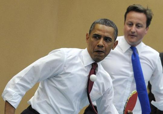 U.S. President Barack Obama (L) and British Prime Minister David Cameron (R) play table tennis with students of the Globe Academy school in London. Queen Elizabeth II on Tuesday deployed British royalty's grandest pomp for Obama, on a state visit meant to prove a 'special relationship' remains 'essential' in a world of shifting power. [Xinhua/AFP Photo]