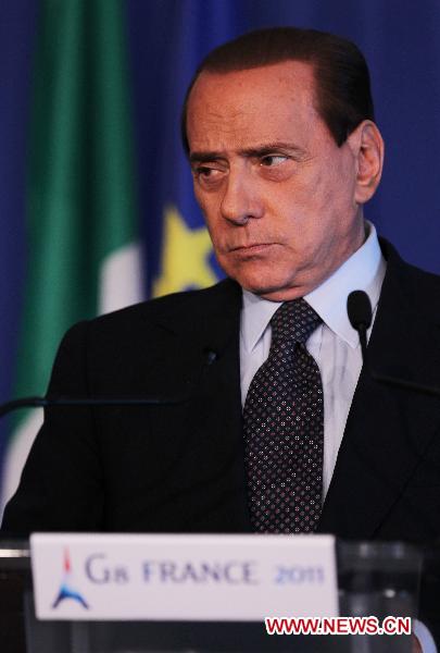Italian Prime Minister Silvio Berlusconi attends a press conference during the G8 summit, in Deauville, northwestern France, on May 27, 2011. [Gao Jing/Xinhua]