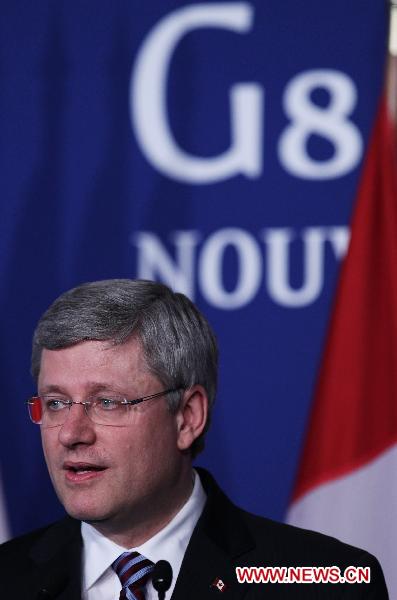 Canadian Prime Minister Stephan Harper attends a press conference during the G8 summit, in Deauville, northwestern France, on May 27, 2011. [Gao Jing/Xinhua]