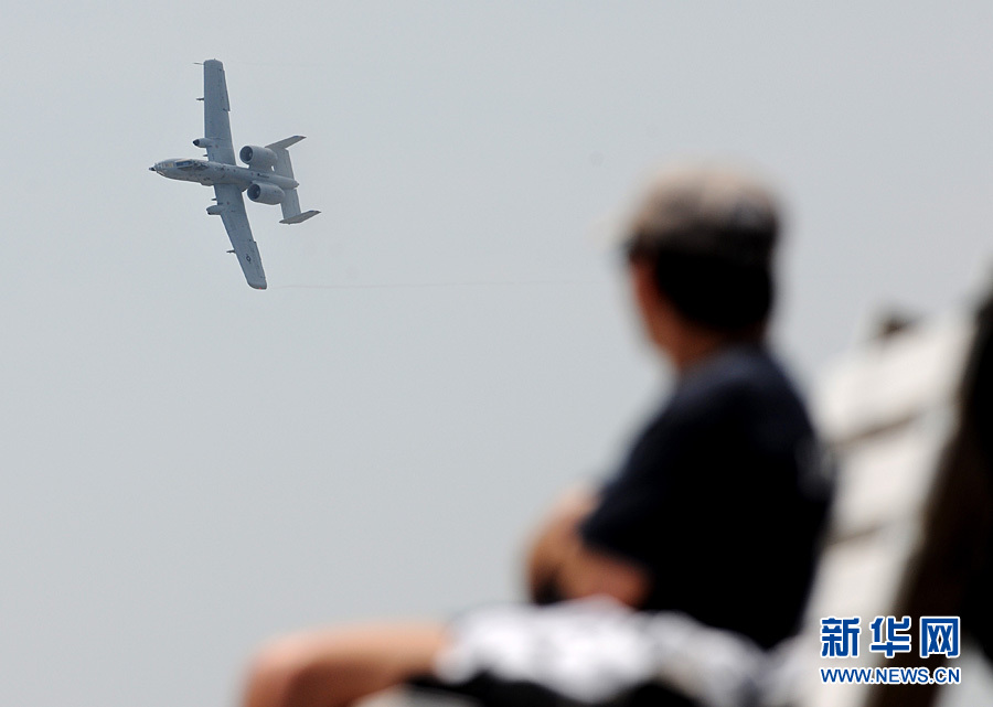 An aircraft performs aerobatics over Johns Beach in New York, the United States, May 28, 2011. 