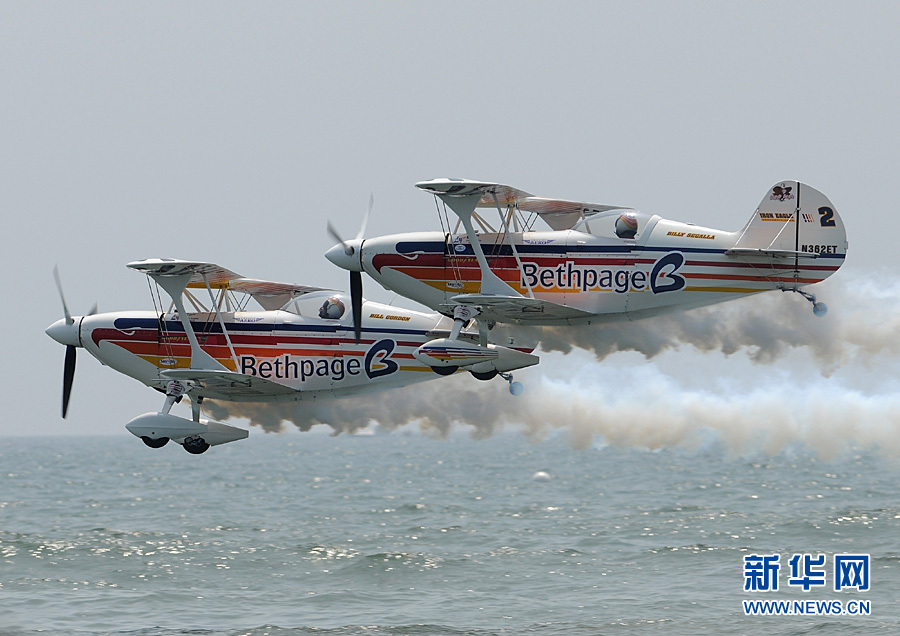 An aircraft performs aerobatics over Johns Beach in New York, the United States, May 28, 2011. 