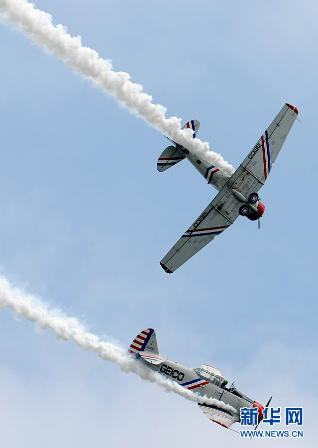 An aircraft performs aerobatics over Johns Beach in New York, the United States, May 28, 2011. 