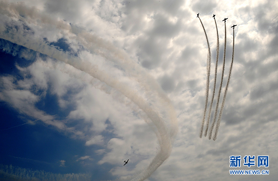 An aircraft performs aerobatics over Johns Beach in New York, the United States, May 28, 2011. 