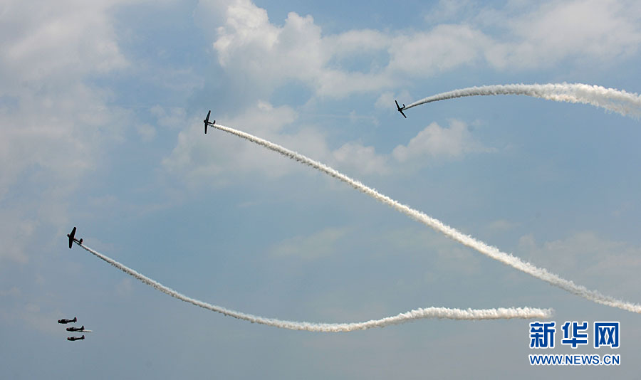 An aircraft performs aerobatics over Johns Beach in New York, the United States, May 28, 2011. 